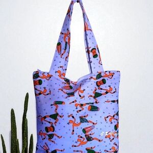 Vibrant Purple Tote Bag with Artistic Design